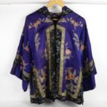 A Chinese purple ground silk embroidered Damask court jacket robe