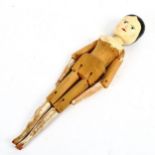 A Folk Art painted peg doll, height 29cm