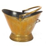 A brass swing-handled coal bucket