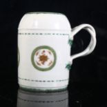 An 18th century Chinese export porcelain tankard, double entwined handles, with hand painted