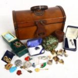 A leather-covered casket containing costume jewellery, badges and studs