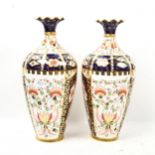 A pair or Royal Crown Derby Imari style vases, with painted and gilded decoration, height 23cm