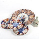 An Imari scallop edge serving plate, 40cm across, 3 Imari plates, and a signed bottle vase