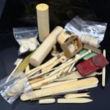 A group of ivory and plastic items, including counters and boxes