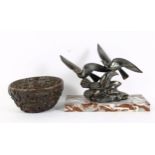 An Art Deco style spelter bird sculpture, signed Limousin, and an Oriental resin 'Dragon' bowl,