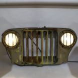 A wall-mounted military jeep radiator grille, with working headlights, width 100cm