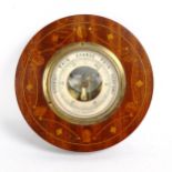 An early 20th century aneroid wall barometer, diameter 20cm