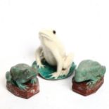 A pair of painted cast-brass toad figures, and a similar pottery example (3)