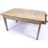 An Antique pine scrub-top kitchen table with end frieze drawer, W137cm, H75cm, D87cm