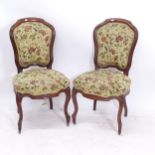 A pair of19th century mahogany side chairs, with floral upholstery on cabriole legs