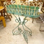 A French oval wirework planter on scrolled stand