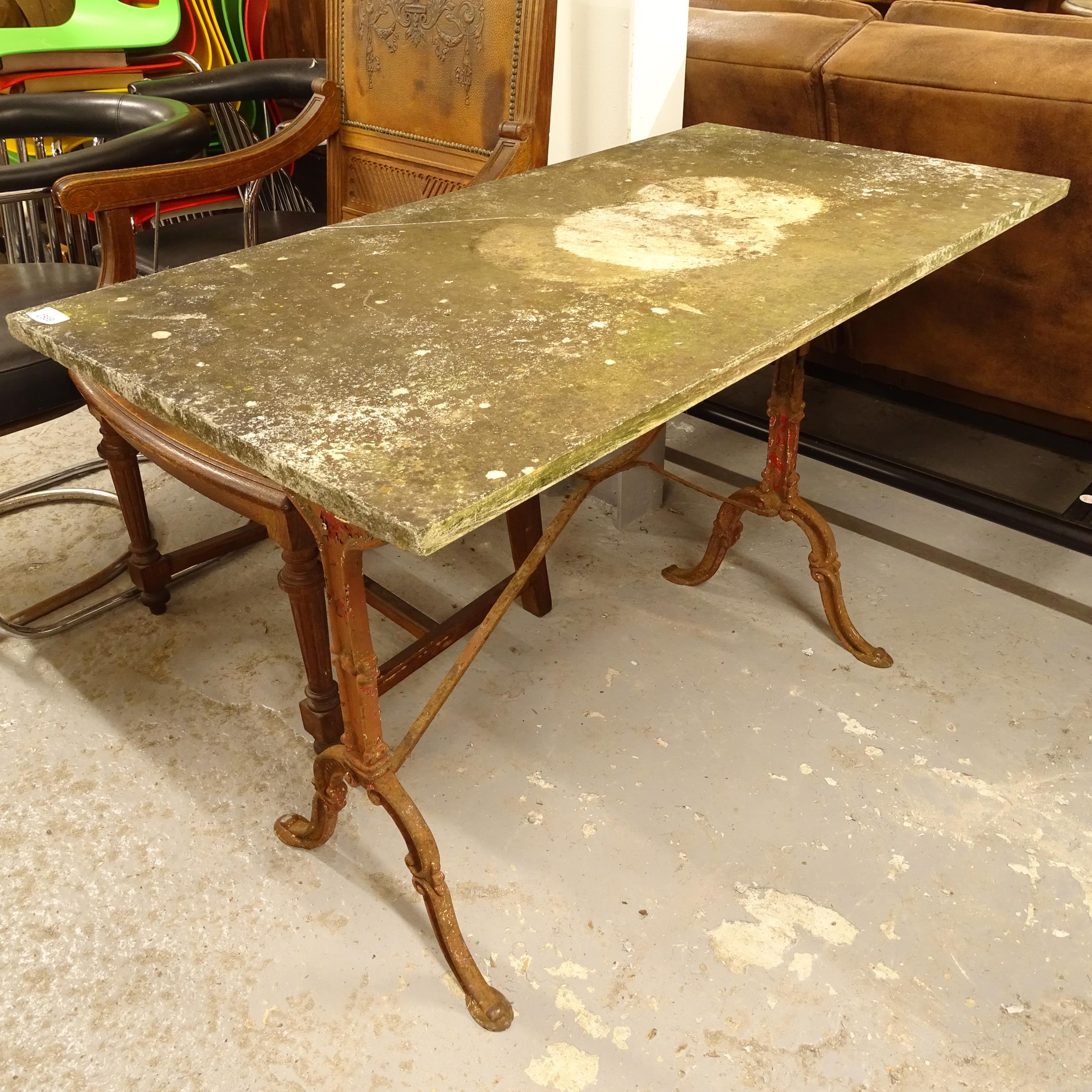 A weathered marble-top garden table, on cast-iron base, L104cm, H72cm, D53cm