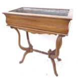 A rectangular oak jardiniere on scrolled stand, with zinc liner, W64cm, H75cm, D35cm