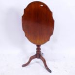 A 19th century mahogany tilt-top wine table with shaped top, on cabriole legs, W42cm