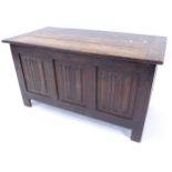 A stained oak coffer with panelled front, W91cm, H50cm, D46cm