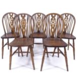 A set of 5 oak and elm-seated wheel-back dining chairs