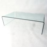 A contemporary design glass rectangular coffee table, W130cm, H36cm, D69cm