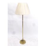 A brass-effect standard lamp and shade, height including shade 157cm