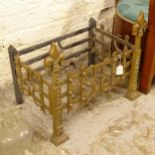 An Arts and Crafts design brass and cast-iron fireplace (missing grate), W54cm, H43cm, D34cm