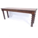 A Victorian mahogany window seat, on turned legs with carved decoration, L120cm