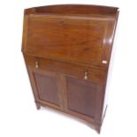 A small 1920s oak bureau, with cupboard doors under, W71cm, H102cm, D26cm