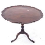 A mahogany lamp table on tripod legs, W50cm, H56cm