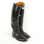A pair of Vintage black leather riding boots