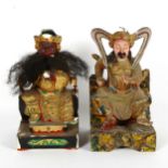 A pair of Chinese painted composition seated Emperor figures, height 26cm