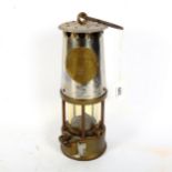 A silver plated brass Protector Lamp & Lighting Co Ltd miner's lamp, height 23cm