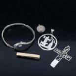 A sterling silver dolphin design bangle, crucifix pendants etc