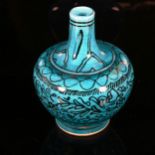 A Middle Eastern Iznik turquoise glaze ceramic narrow-neck vase, with hand painted decoration,