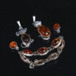 A silver and amber "Cat and Mouse design" pendant, a silver bracelet and matching earrings
