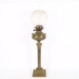 An early 20th century Duplex brass Corinthian column oil lamp, with glass funnel and shade, height