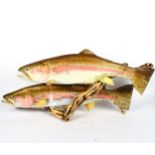 A carved and painted wood sculpture of 2 leaping salmon, length 79cm