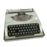 A Vintage metal typewriter by M J Rooy, in fitted metal case