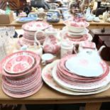 A large quantity of pink and white transfer printed dinner and teaware, including Enoch Wedgwood,