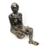 A painted plaster sculpture of a seated woman, height 44cm