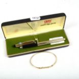 A 9ct gold bangle, 3.9g, and a 10ct gold plated soft tip pen by Cross, boxed (2)