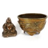 A Chinese polished bronze phoenix and Qilin incense burner bowl, and a silvered resin Buddha (2)