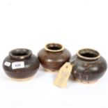 3 Eastern brown glazed clay pots, height 9cm