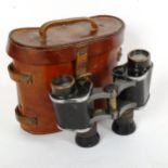 A pair of First World War Period military issue binoculars, in original leather case, by T