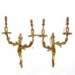 A pair of gilt-metal twin-branch wall lights of foliate design, height overall 40cm