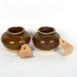 A pair of Thai brown glaze pottery jars, diameter 11cm, with attached export documents