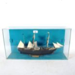A small scale model Discovery 1901 ship, in perspex case, width 61cm
