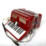 A Stella piano accordion in case