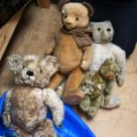 A group of 4 teddy bears, including Alpha Toys