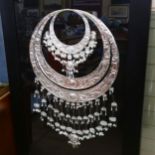 A large framed and glazed Chinese Miao necklace, overall 142cm x 89cm