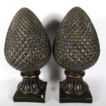 A large pair of resin pineapple finials, height 54cm