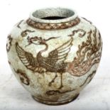 A Chinese crackle glaze pottery jar, with mythical bird design, height 22cm