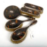 An early 20th century silver and mother-of-pearl 5-piece dressing table brush and mirror set,